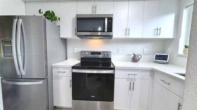 8449 NW 4th Ave Unit 8449, Miami, FL 33150 - kitchen with stainless steel appliances and white cabinetry