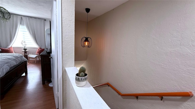 8449 NW 4th Ave Unit 8449, Miami, FL 33150 - bedroom featuring a textured wall and wood finished floors