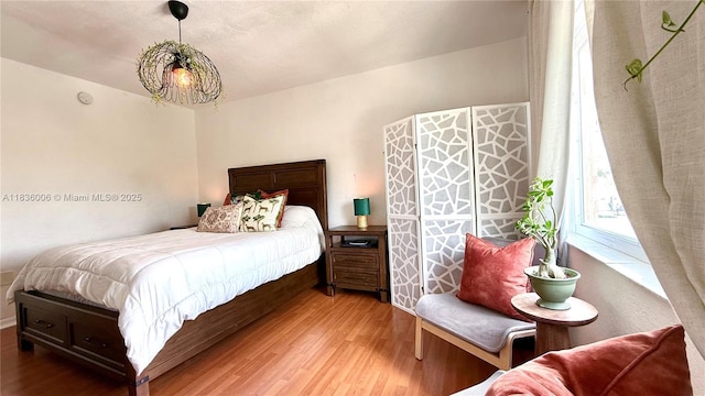 8449 NW 4th Ave Unit 8449, Miami, FL 33150 - bedroom with wood finished floors and a chandelier
