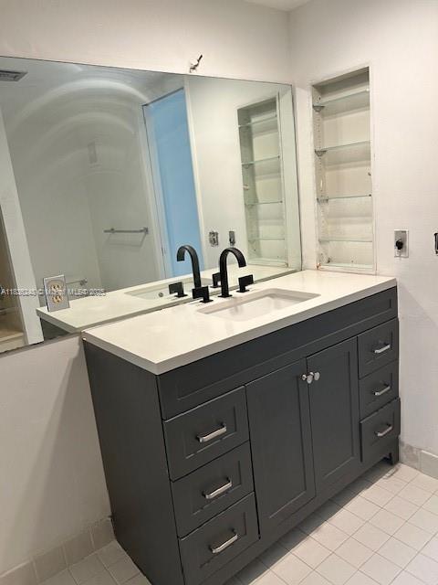 3503 Oaks Way Unit 212, Pompano Beach, FL 33069 - bathroom featuring tile patterned floors and vanity