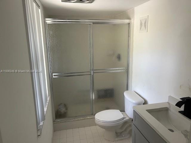 3503 Oaks Way Unit 212, Pompano Beach, FL 33069 - full bathroom with vanity, a shower with door, and tile patterned flooring