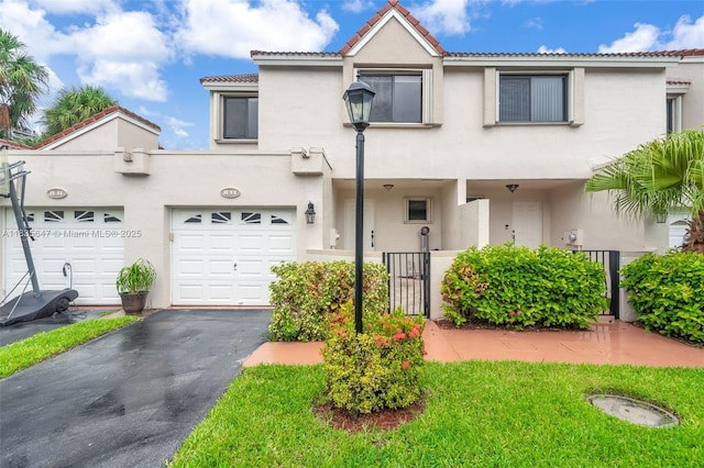 21160 Mainsail Cir Unit H12, Aventura, FL 33180 - view of front of home with stucco siding, asphalt driveway, and a tile roof
