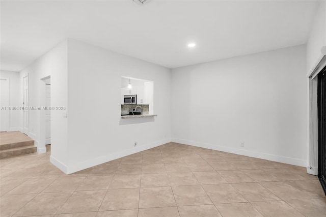 21160 Mainsail Cir Unit H12, Aventura, FL 33180 - unfurnished living room featuring light tile patterned flooring and recessed lighting