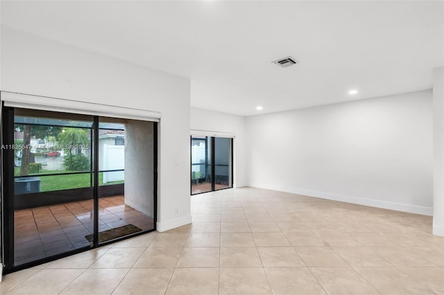21160 Mainsail Cir Unit H12, Aventura, FL 33180 - empty room with light tile patterned flooring and recessed lighting