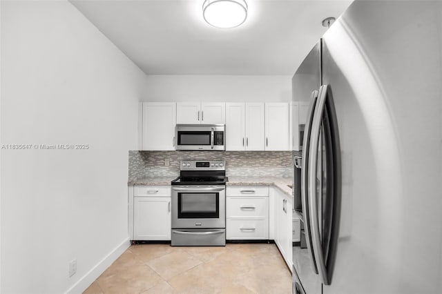 21160 Mainsail Cir Unit H12, Aventura, FL 33180 - kitchen featuring stainless steel appliances, white cabinetry, and backsplash