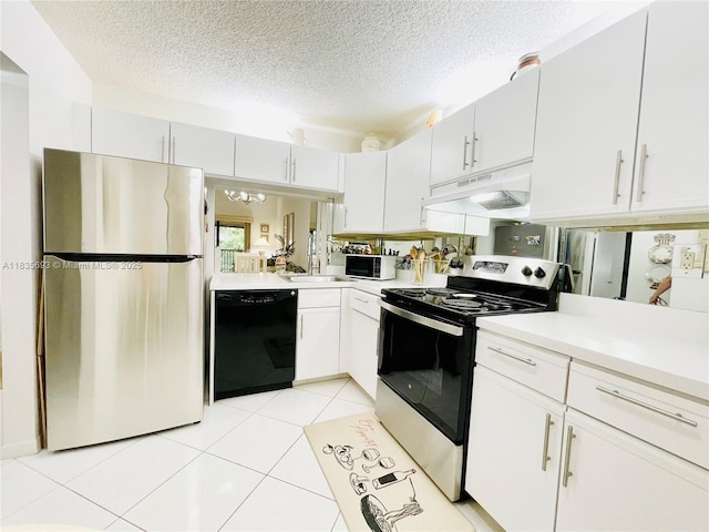 3137 S Carambola Cir S Unit 2369, Coconut Creek, FL 33066 - kitchen featuring appliances with stainless steel finishes, under cabinet range hood, a textured ceiling, light countertops, and light tile patterned flooring