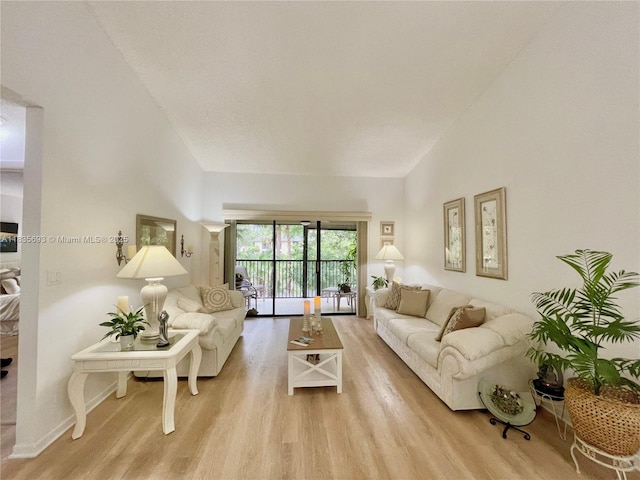 3137 S Carambola Cir S Unit 2369, Coconut Creek, FL 33066 - living room with wood finished floors and lofted ceiling