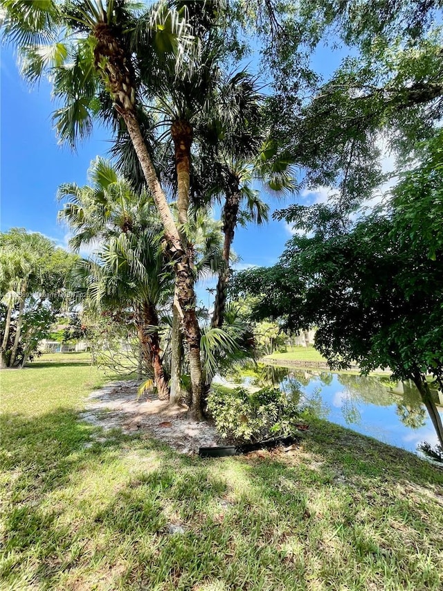 3137 S Carambola Cir S Unit 2369, Coconut Creek, FL 33066 - view of grassy yard featuring a water view