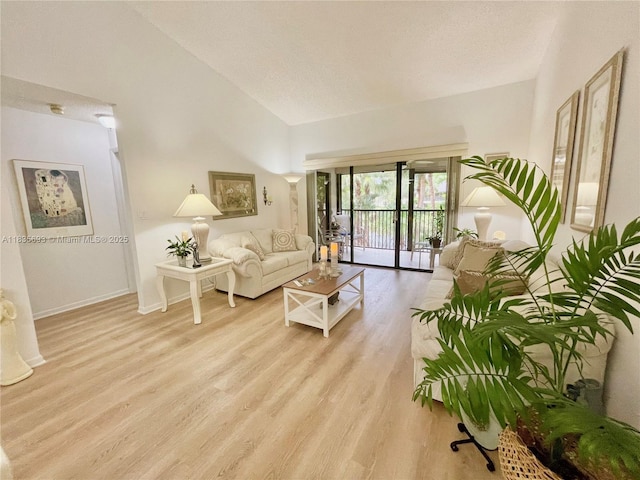 3137 S Carambola Cir S Unit 2369, Coconut Creek, FL 33066 - living area featuring vaulted ceiling and wood finished floors
