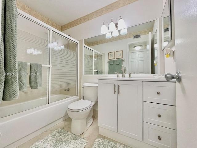 3137 S Carambola Cir S Unit 2369, Coconut Creek, FL 33066 - bathroom with vanity, tile patterned flooring, and combined bath / shower with glass door