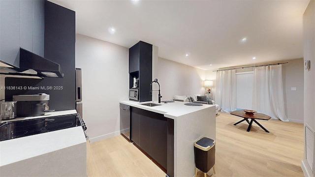 10824 N Kendall Dr Unit S28, Miami, FL 33176 - kitchen featuring modern cabinets, light wood-style floors, light countertops, a peninsula, and open floor plan