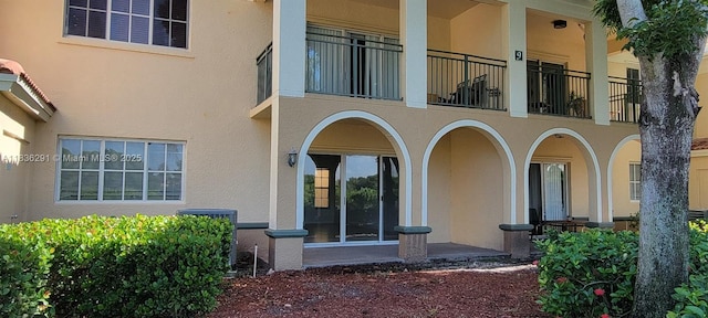 2452 Centergate Dr Unit 103, Miramar, FL 33025 - doorway to property featuring stucco siding and a balcony