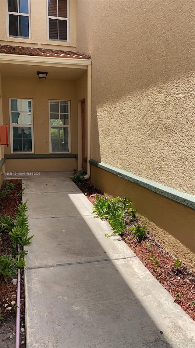 2452 Centergate Dr Unit 103, Miramar, FL 33025 - property entrance with stucco siding
