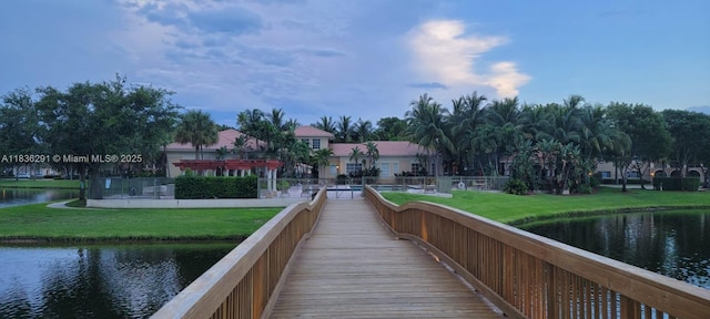 2452 Centergate Dr Unit 103, Miramar, FL 33025 - dock area with a water view and a yard