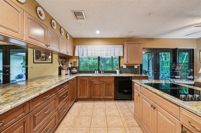 10875 NW 17th Mnr, Coral Springs, FL 33071 - kitchen with black appliances, a textured ceiling, light stone countertops, light tile patterned flooring, and recessed lighting