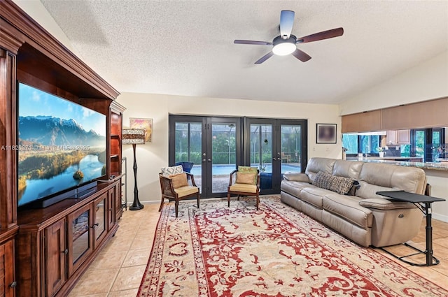 10875 NW 17th Mnr, Coral Springs, FL 33071 - living area with french doors, a ceiling fan, light tile patterned floors, a textured ceiling, and lofted ceiling