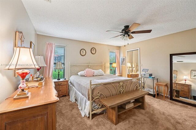 10875 NW 17th Mnr, Coral Springs, FL 33071 - bedroom featuring light colored carpet, multiple windows, a textured ceiling, and ceiling fan