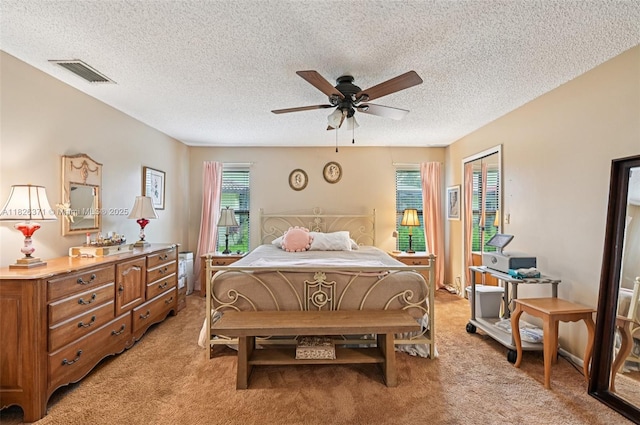 10875 NW 17th Mnr, Coral Springs, FL 33071 - bedroom featuring light colored carpet, a textured ceiling, and ceiling fan