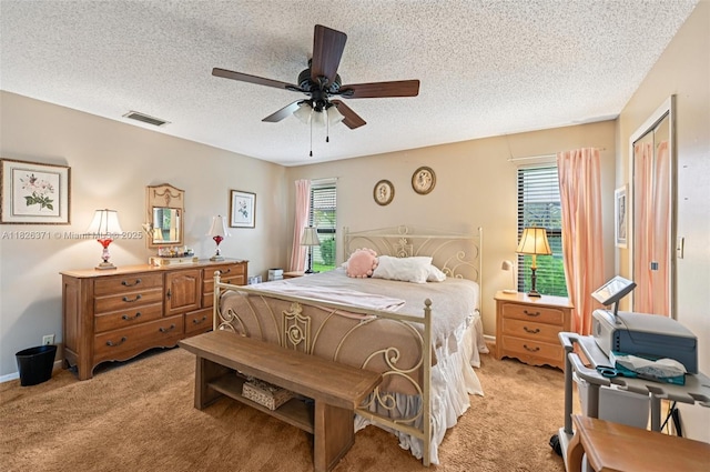 10875 NW 17th Mnr, Coral Springs, FL 33071 - bedroom with light colored carpet, a textured ceiling, and a ceiling fan
