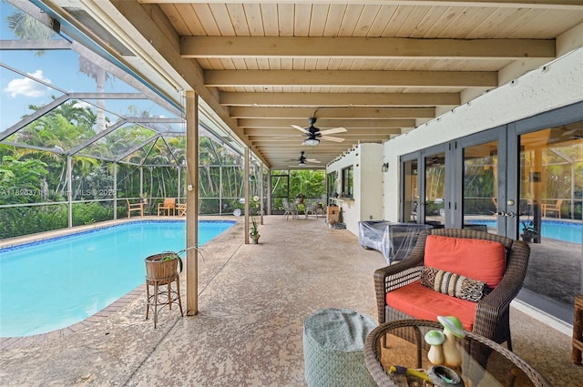 10875 NW 17th Mnr, Coral Springs, FL 33071 - swimming pool with french doors, a patio area, ceiling fan, and a lanai