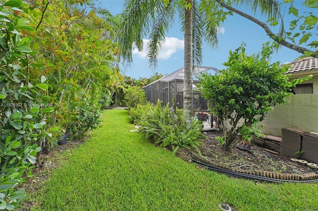 10875 NW 17th Mnr, Coral Springs, FL 33071 - view of grassy yard with a lanai
