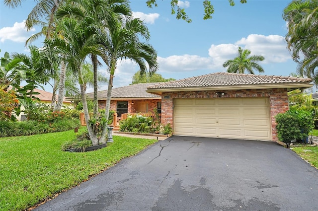 10875 NW 17th Mnr, Coral Springs, FL 33071 - ranch-style home with a tiled roof, asphalt driveway, brick siding, and a front yard