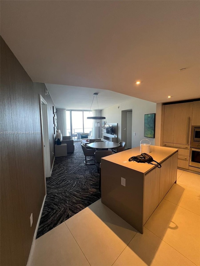 4111 S Ocean Dr Unit 2004, Hollywood, FL 33019 - kitchen featuring stainless steel appliances, modern cabinets, light tile patterned flooring, a center island, and open floor plan