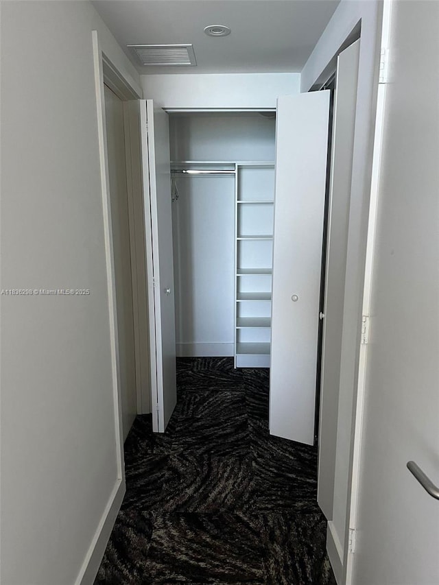 4111 S Ocean Dr Unit 2004, Hollywood, FL 33019 - corridor with marble look tile flooring and attic access