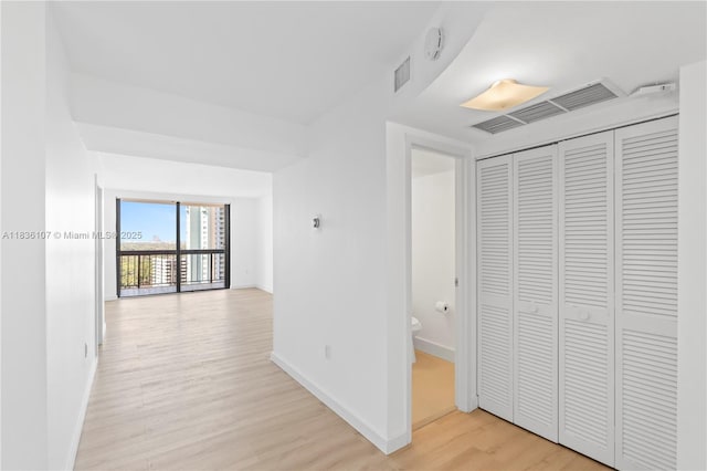 2333 Brickell Ave Unit 1908, Miami, FL 33129 - corridor with light wood-type flooring and baseboards