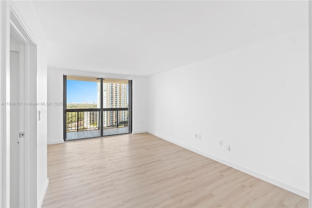 2333 Brickell Ave Unit 1908, Miami, FL 33129 - unfurnished room featuring light wood-style floors and floor to ceiling windows