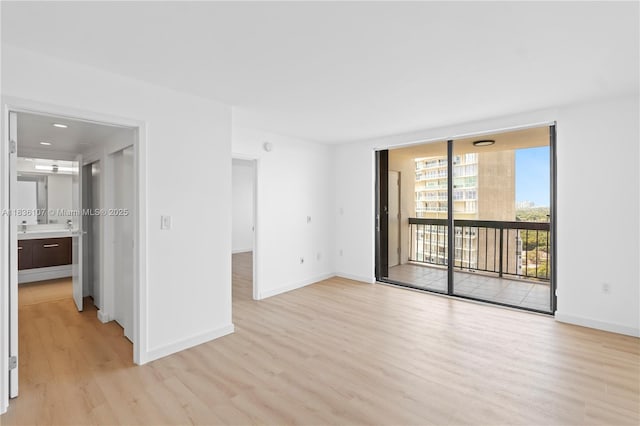 2333 Brickell Ave Unit 1908, Miami, FL 33129 - empty room featuring light wood finished floors and expansive windows