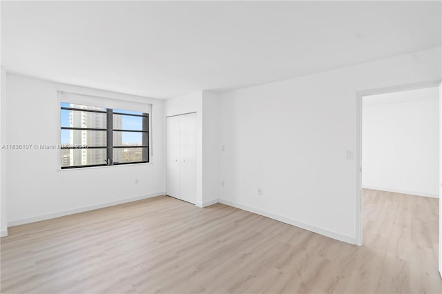 2333 Brickell Ave Unit 1908, Miami, FL 33129 - unfurnished room with light wood-type flooring and baseboards