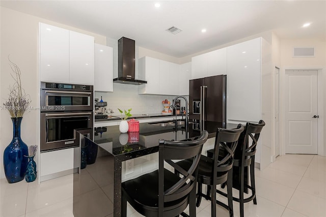 401 SW 91st Ave, Miami, FL 33174 - kitchen with wall chimney exhaust hood, fridge with ice dispenser, light tile patterned floors, a breakfast bar area, and recessed lighting