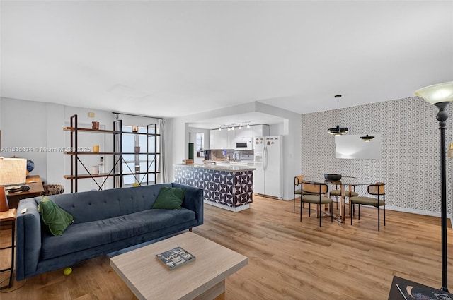 1340 Lincoln Rd Unit 403, Miami Beach, FL 33139 - living room featuring light wood-type flooring and wallpapered walls