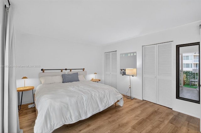 1340 Lincoln Rd Unit 403, Miami Beach, FL 33139 - bedroom featuring two closets and wood finished floors