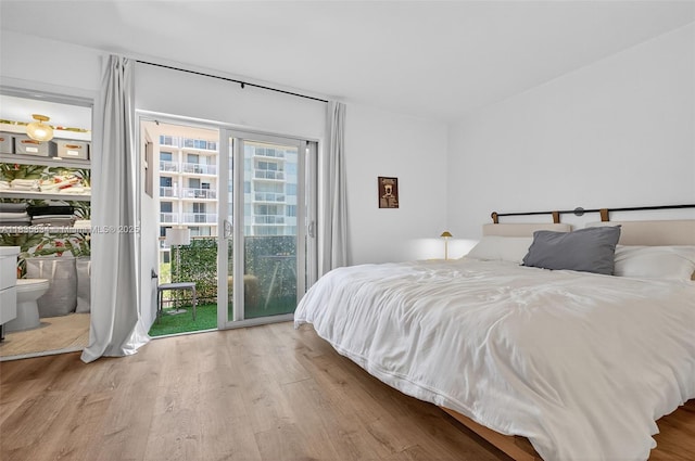 1340 Lincoln Rd Unit 403, Miami Beach, FL 33139 - bedroom featuring access to exterior and wood finished floors