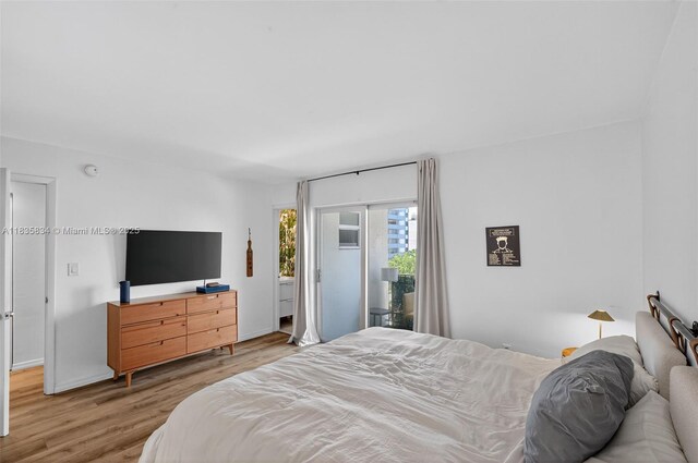 1340 Lincoln Rd Unit 403, Miami Beach, FL 33139 - bedroom featuring access to outside and wood finished floors