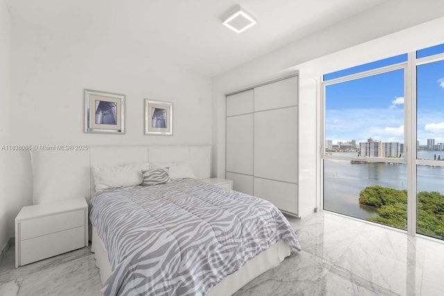 400 Sunny Isles Blvd Unit 2008, Sunny Isles Beach, FL 33160 - bedroom featuring light marble finish floors, a closet, a view of city, a water view, and access to outside