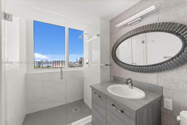 400 Sunny Isles Blvd Unit 2008, Sunny Isles Beach, FL 33160 - full bathroom featuring tile walls, vanity, a shower stall, and a view of city