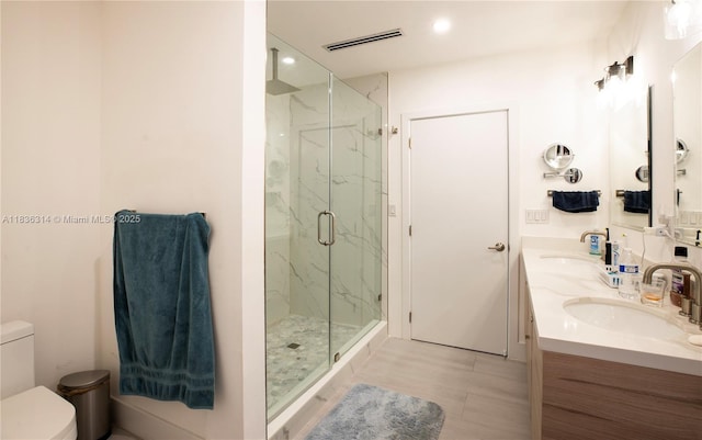 380 Morningside Dr, Miami Springs, FL 33166 - bathroom with a marble finish shower, double vanity, and recessed lighting