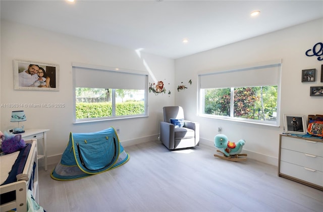380 Morningside Dr, Miami Springs, FL 33166 - bedroom featuring multiple windows, wood finished floors, and recessed lighting