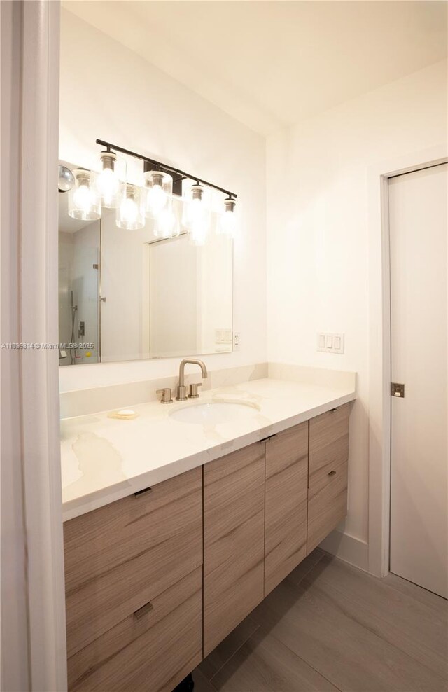 380 Morningside Dr, Miami Springs, FL 33166 - bathroom featuring vanity and wood finished floors
