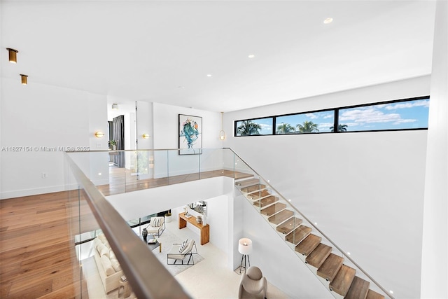 1510 Stillwater Dr, Miami Beach, FL 33141 - stairs featuring wood finished floors and recessed lighting