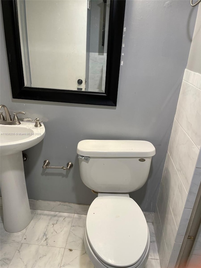 8735 Ramblewood Dr Unit 114, Coral Springs, FL 33071 - bathroom with toilet and marble look tile flooring