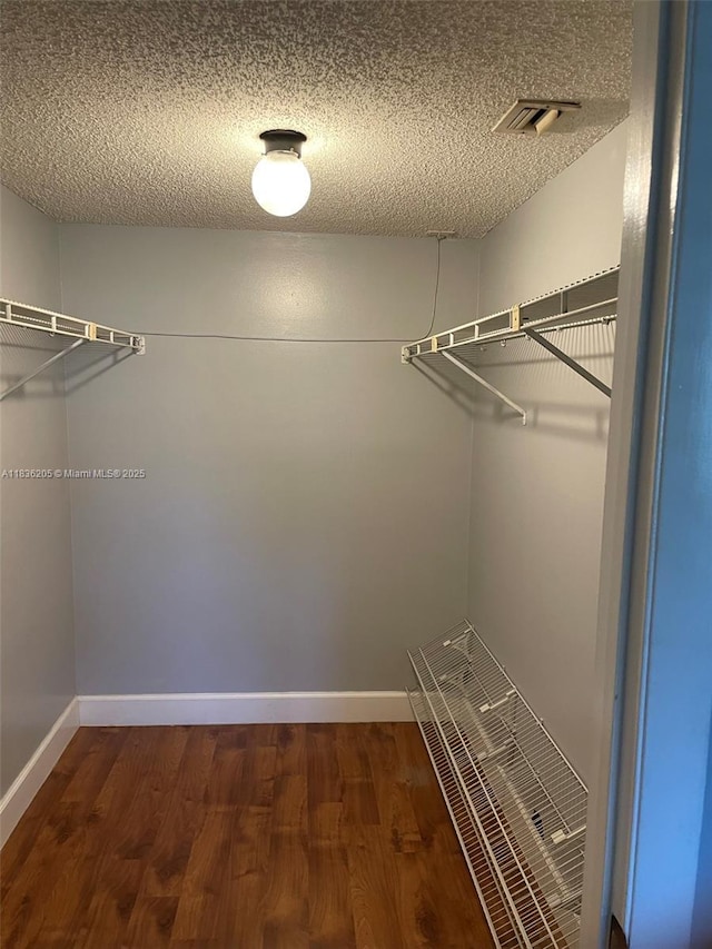 8735 Ramblewood Dr Unit 114, Coral Springs, FL 33071 - spacious closet with dark wood finished floors