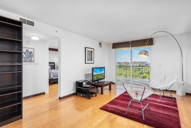 816 NW 11th St Unit 1101, Miami, FL 33136 - living room featuring wood finished floors and baseboards
