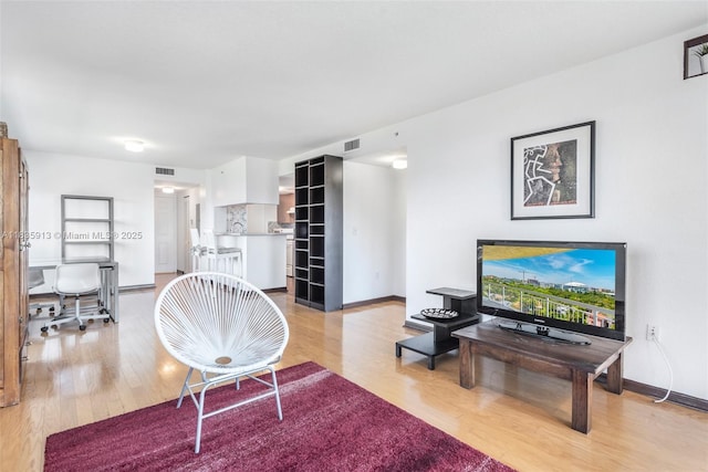 816 NW 11th St Unit 1101, Miami, FL 33136 - living room with light wood-type flooring and baseboards