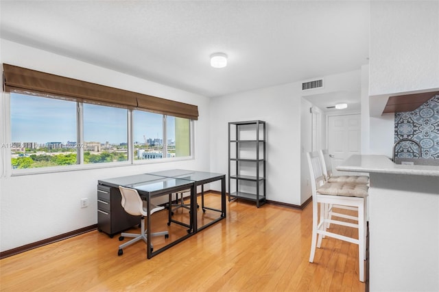 816 NW 11th St Unit 1101, Miami, FL 33136 - dining space with healthy amount of natural light, light wood finished floors, and a desk