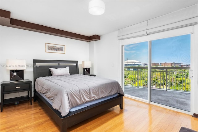 816 NW 11th St Unit 1101, Miami, FL 33136 - bedroom with access to outside and light wood-type flooring