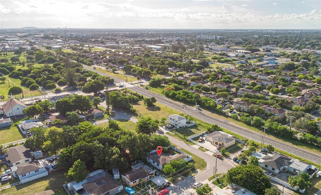 7190 NW 21st Ave, Miami, FL 33147 - aerial view of property and surrounding area with nearby suburban area